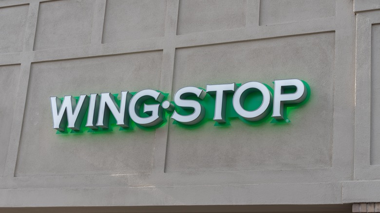 Close up of Wingstop logo sign on the building in Salt Lake City, Utah, USA.