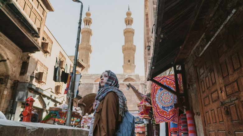 Woman walking a street in Cairo