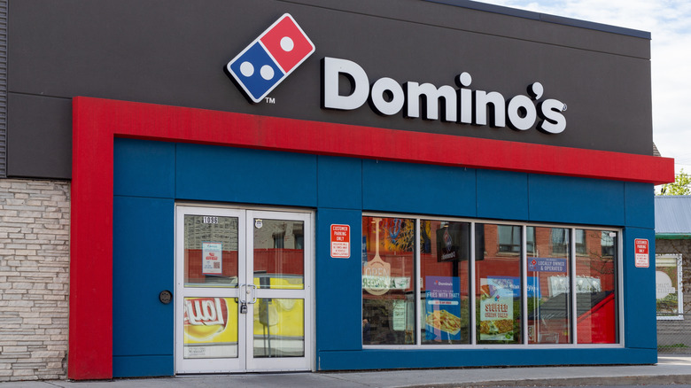 The exterior of a Dominos pizza franchise