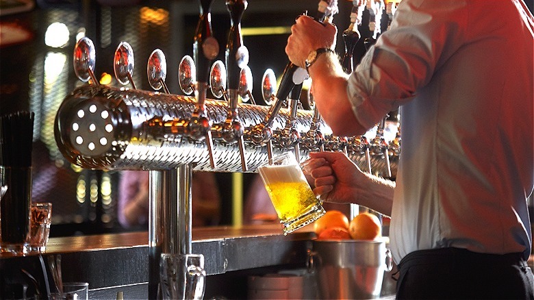 Bartender pouring a draught beer