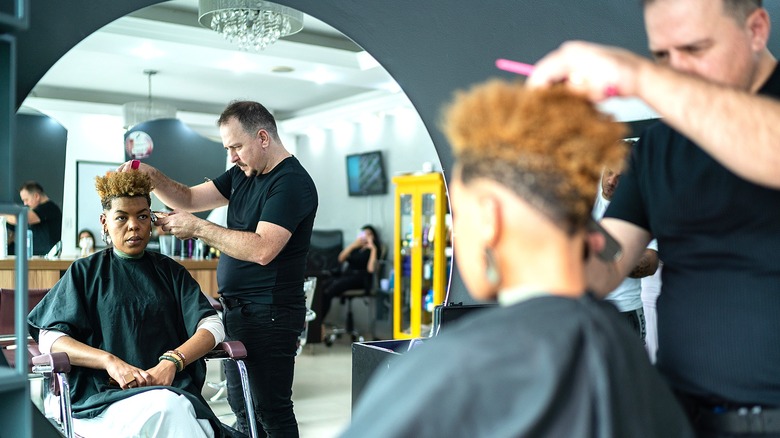 Person getting their hair styled