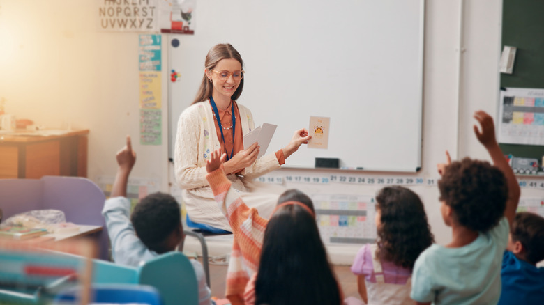 Teacher giving lesson to students.