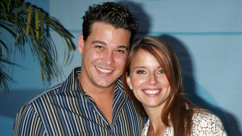 Rob Mariano and Amber Brkich smiling for cameras.
