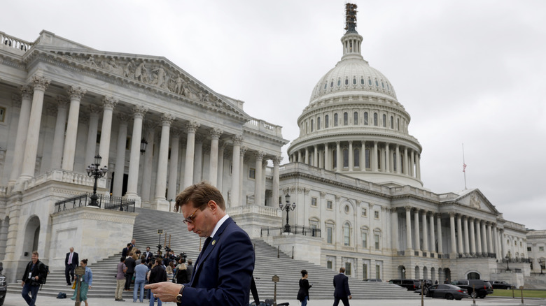 Politician walking by U.S. Capitol Building