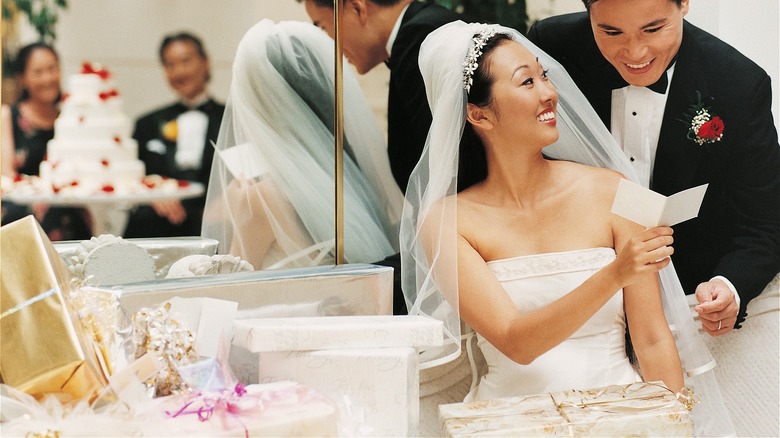 Wedding couple looking at gifts