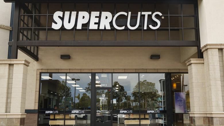 a Supercuts storefront and sign