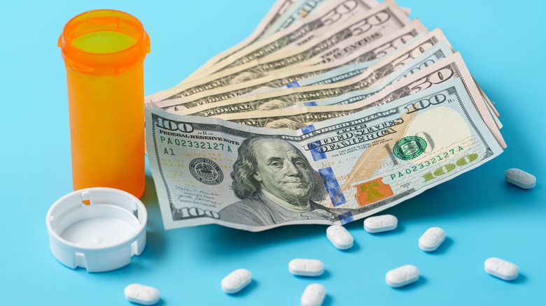 prescription pills and hundred-dollar bills
