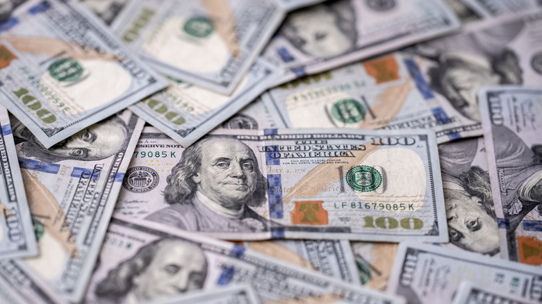 A pile of U.S. $100 bills.