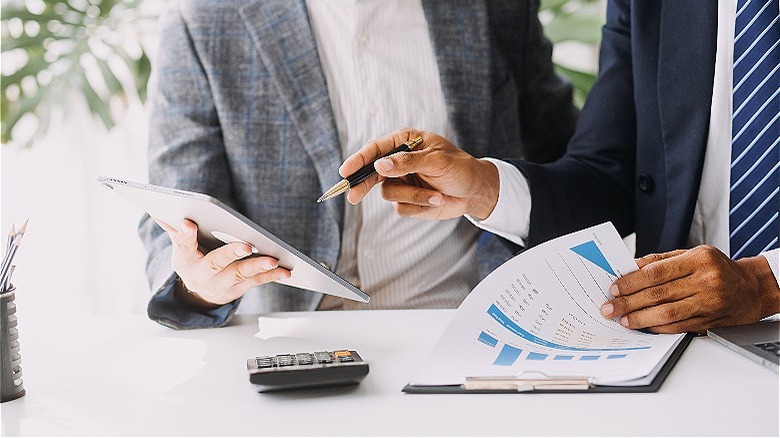 Person making presentation with papers