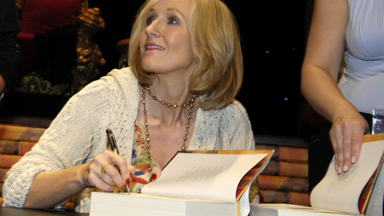 Author JK Rowling signing a book