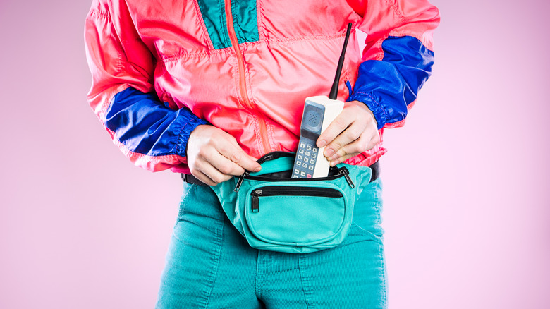 Person with vintage clothing and mobile phone