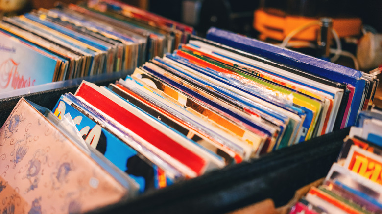 A crate full of vinyl records for sale