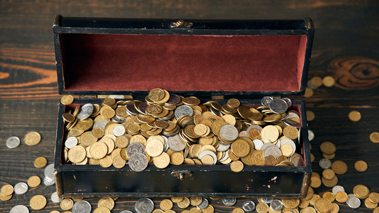 Trunk filled with an assortment of coins