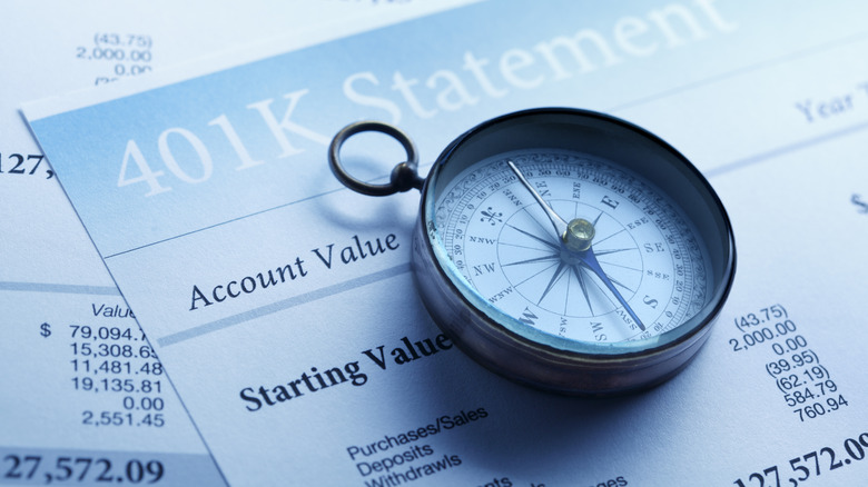 Compass on top of a 401(k) statement