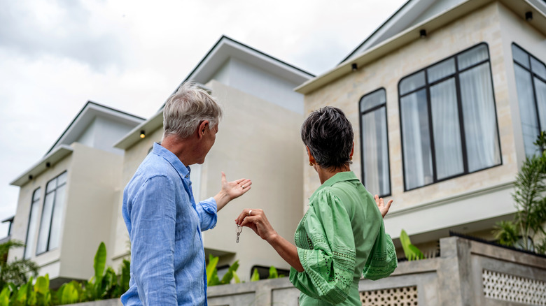 Seniors outside a house