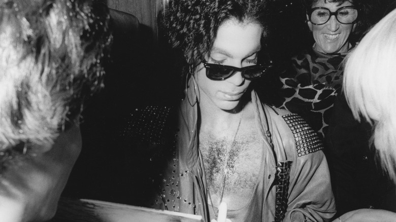 A black-and-white paparazzi shot of Prince in the 1980s.