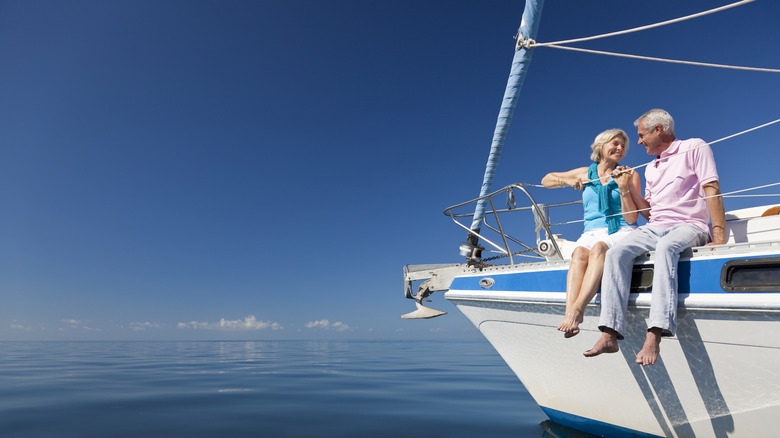 Couple sitting on boat and enjoying retirement.