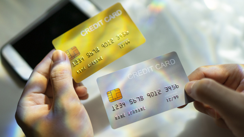 hands holding credit cards
