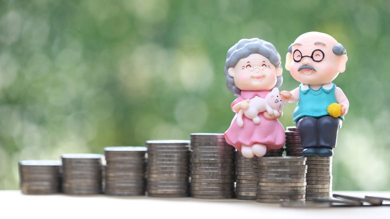 senior people figures on stacks of coins