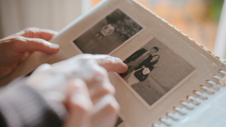 looking at old photos in an album