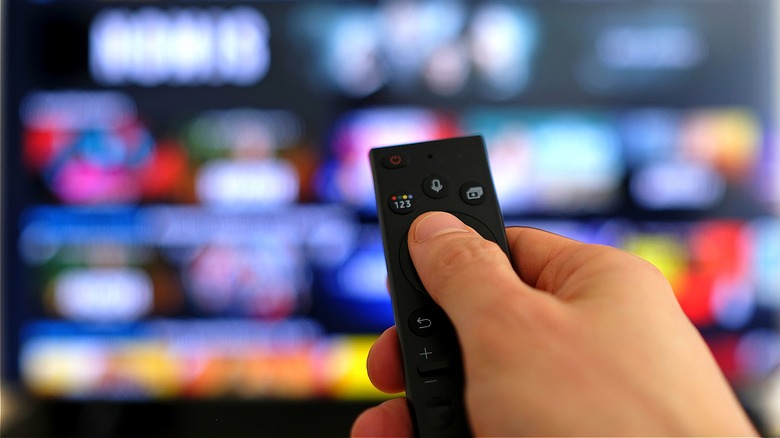 Person using streaming television remote