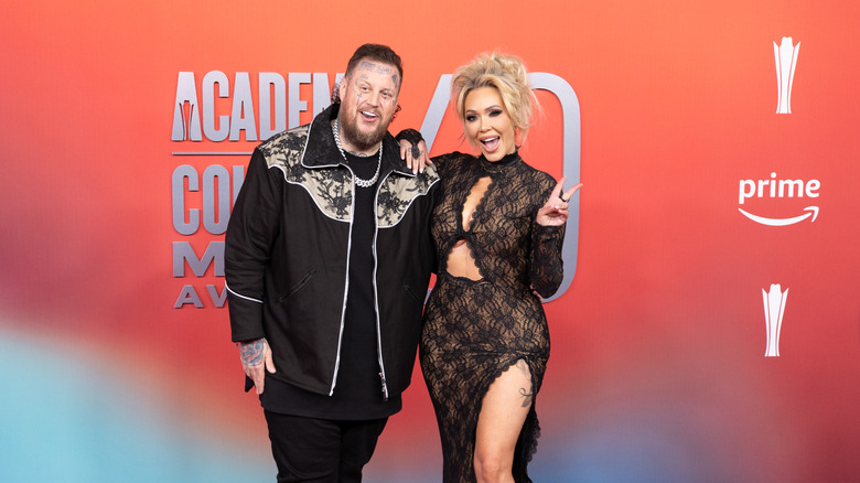Jelly Roll and Bunnie Xo smiling together on the red carpet