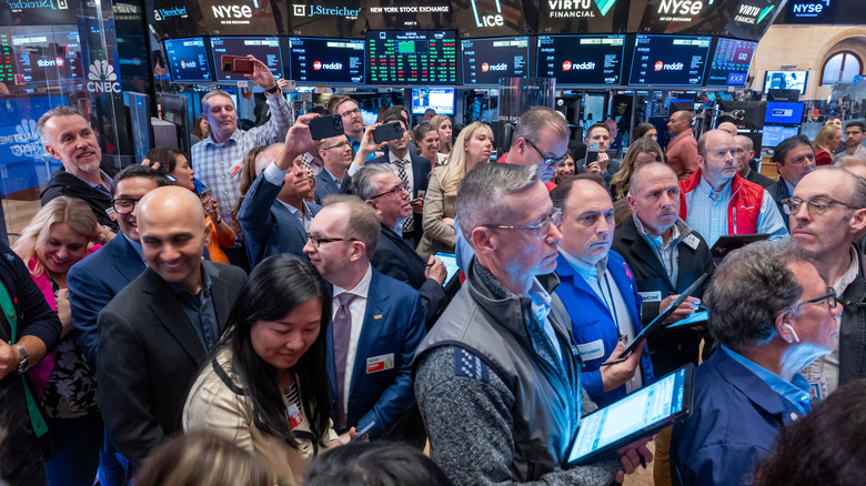 People on the floor of the stock market exchange