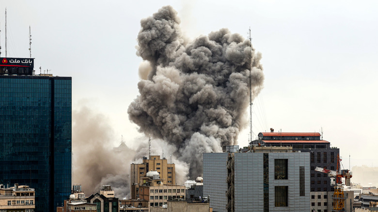 Smoke rises from a building after an explosion during the Iran conflict