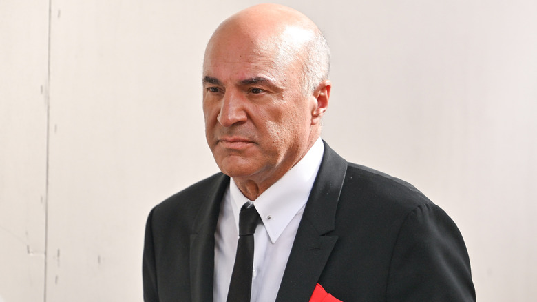 Kevin O'Leary outside a building