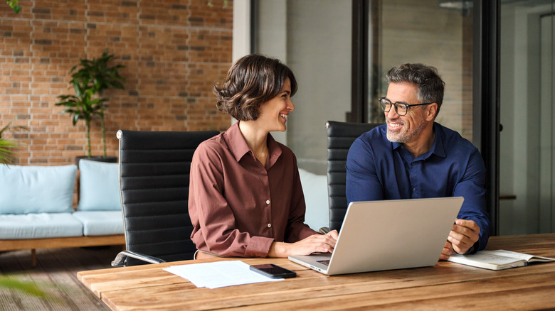 consultants sitting at a desk