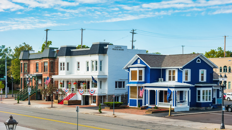Homes lining a street on a sunny day.