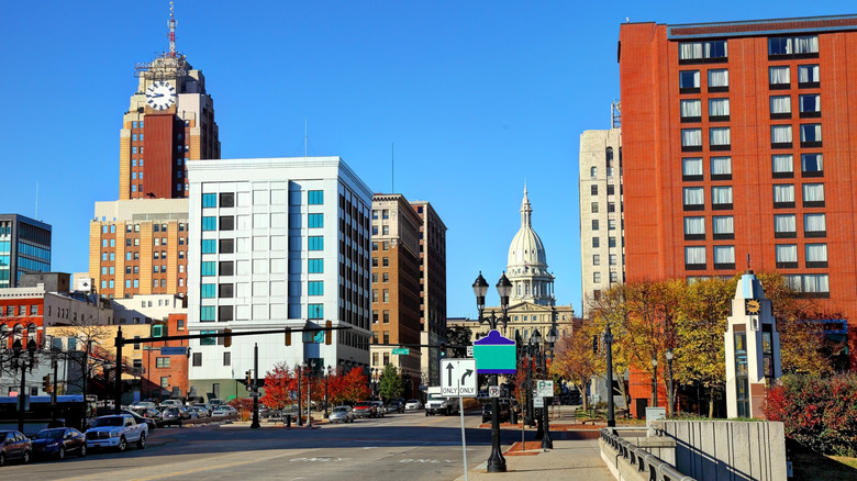 A mostly empty street in Lansing, Michigan with the Capital Building in the background