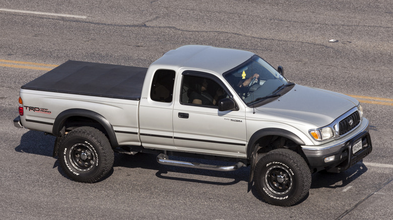 A Toyota Tacoma driving on a highway.