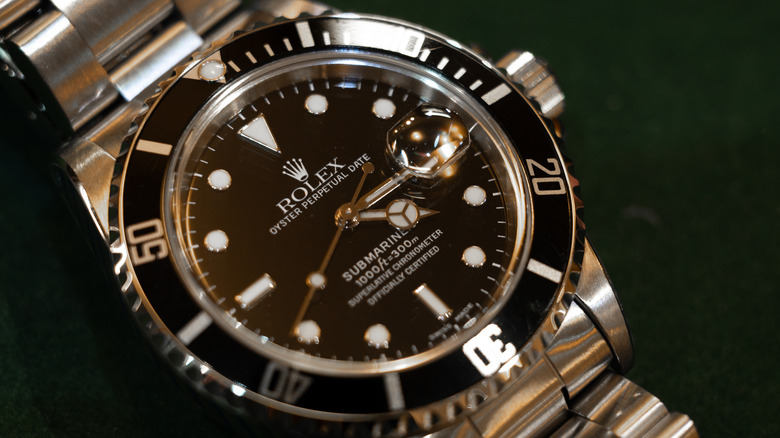 A second hand Rolex Oyster Perpetual Submariner Date watch is displayed for sale