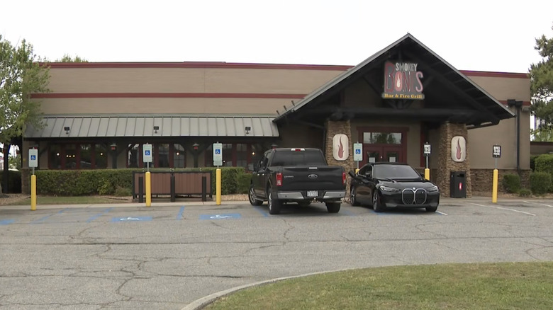 The parking lot and front door of a closed Smokey Bones location
