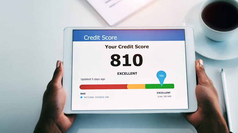 810 credit score listed on a tablet screen