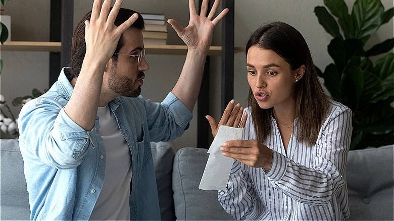 couple arguing over a receipt