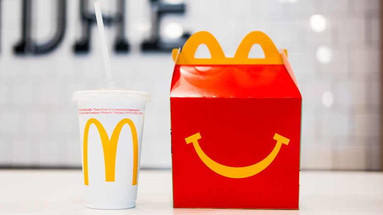 A McDonald's Happy Meal and Drink in bright lighting
