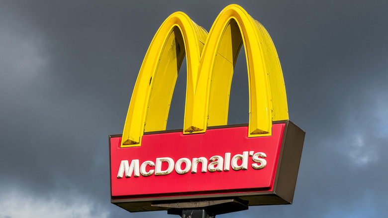McDonald's sign in Los Angeles with cloudy sky in the background.
