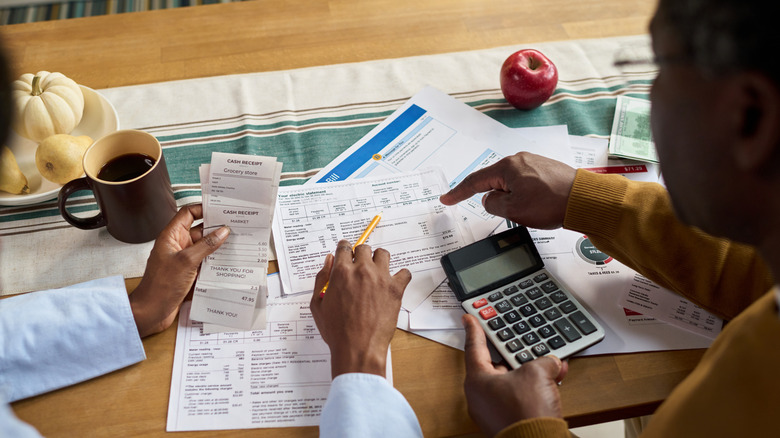 A couple reviewing financial records.
