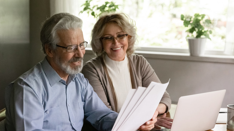 retired couple looking at documents