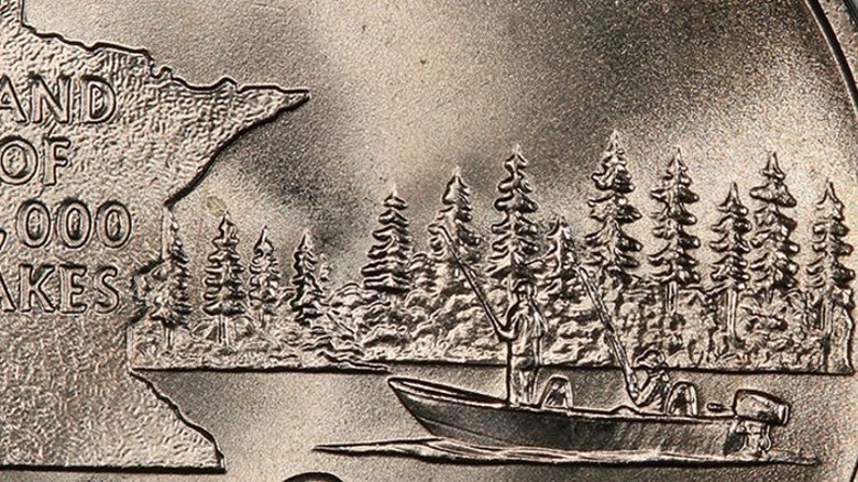 A crisp close-up of a Minnesota state quarter with an extra tree due to a doubled die error.