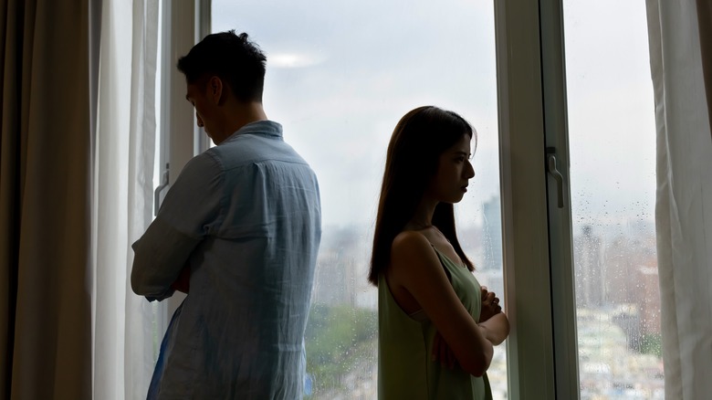 Couple facing away from each other