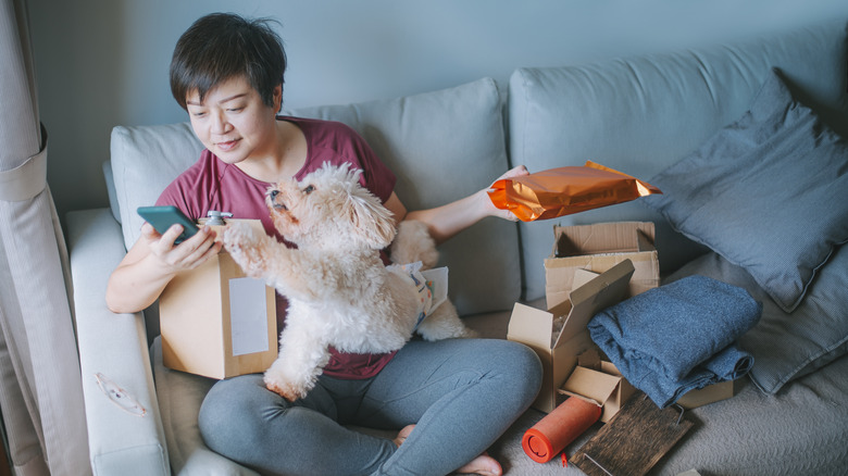 Person surrounded by packages