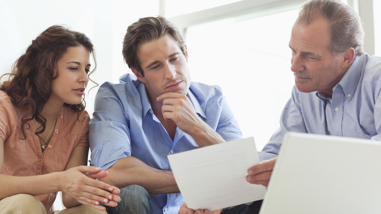 a financial advisor with clients