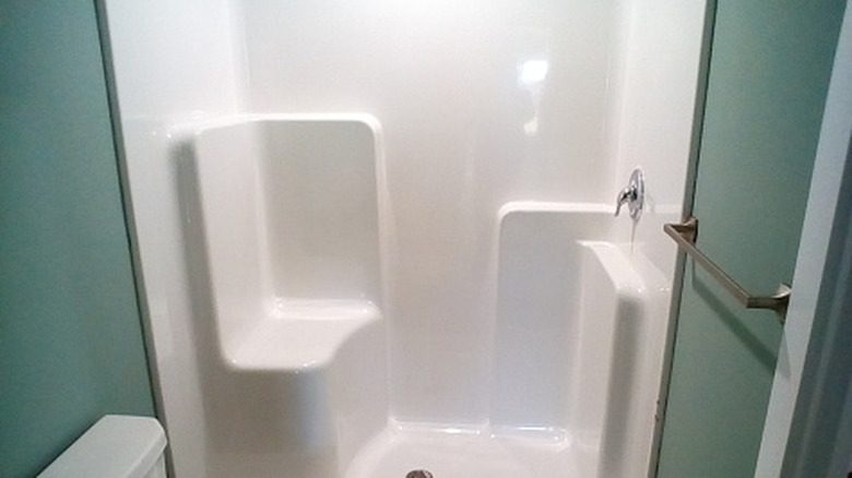 Close up of walk-in shower with seating