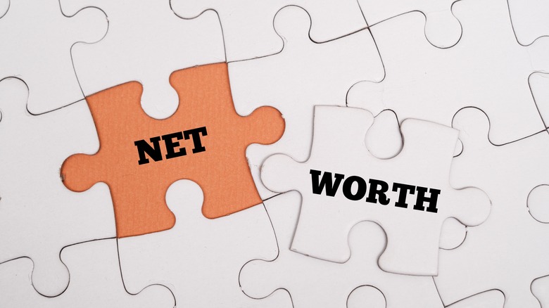 Net worth spelled out on puzzle pieces