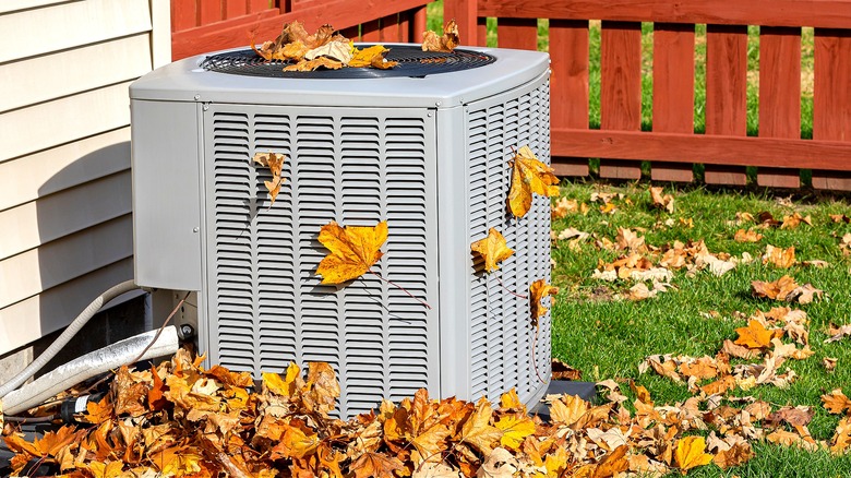 Condenser covered in autumn leaves