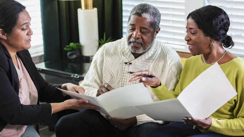 Older couple going over financial projections with an accountant