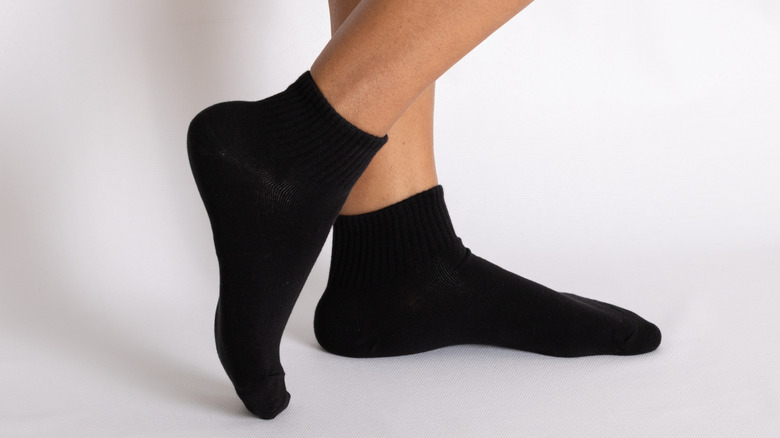 Woman waring black low-cut socks